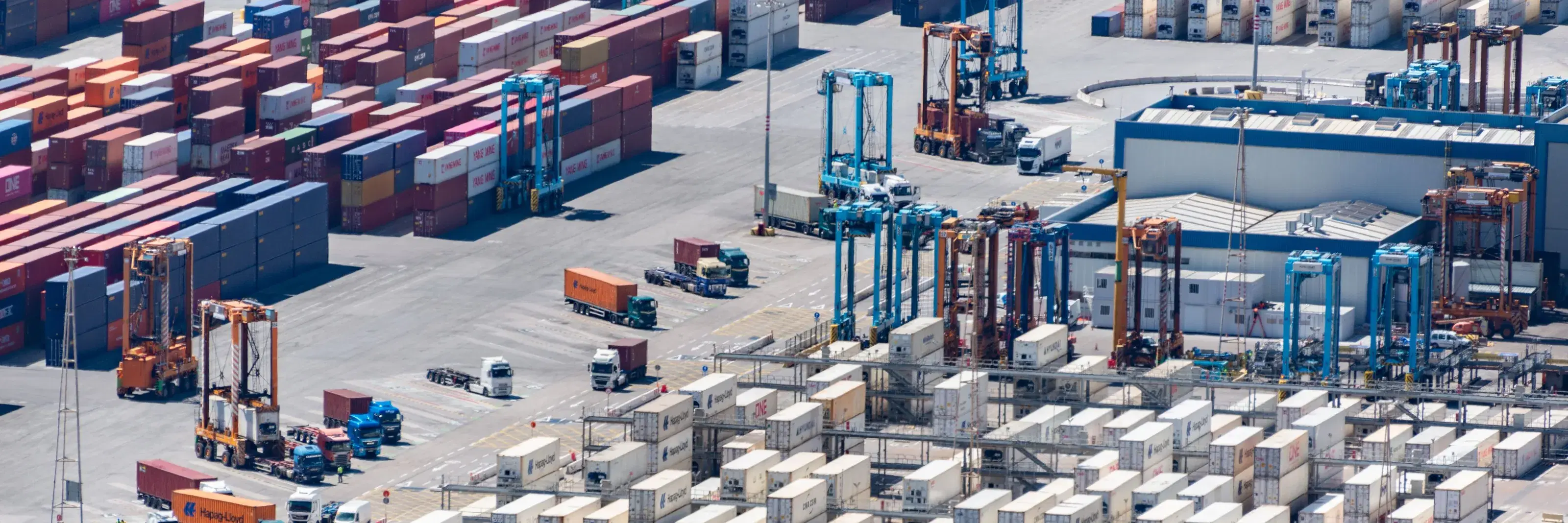 A container yard with gantry cranes over the stacks