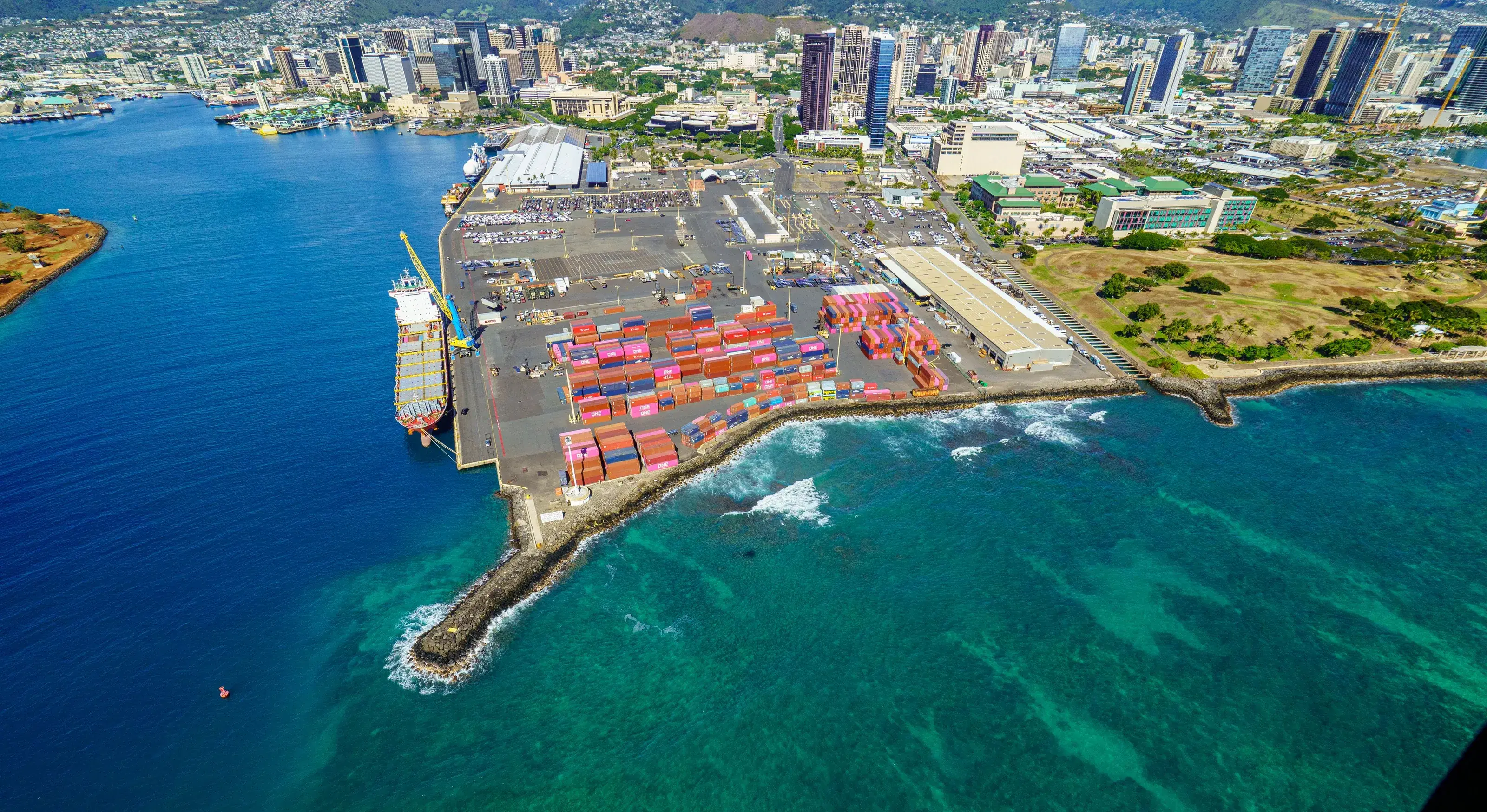 Aerial view of a harbour beside a city